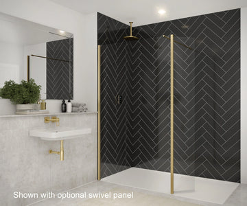 Modern bathroom with black herringbone shower wall and gold fixtures.