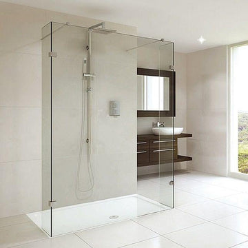 Modern wet room with glass shower enclosure and minimalist design.