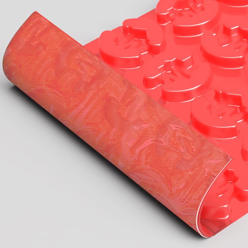 Close-up of Warmup DCM-PRO System UFH Installation Mat V3 0.73m² showing flexible red membrane with textured underside for secure insulation board adhesion.