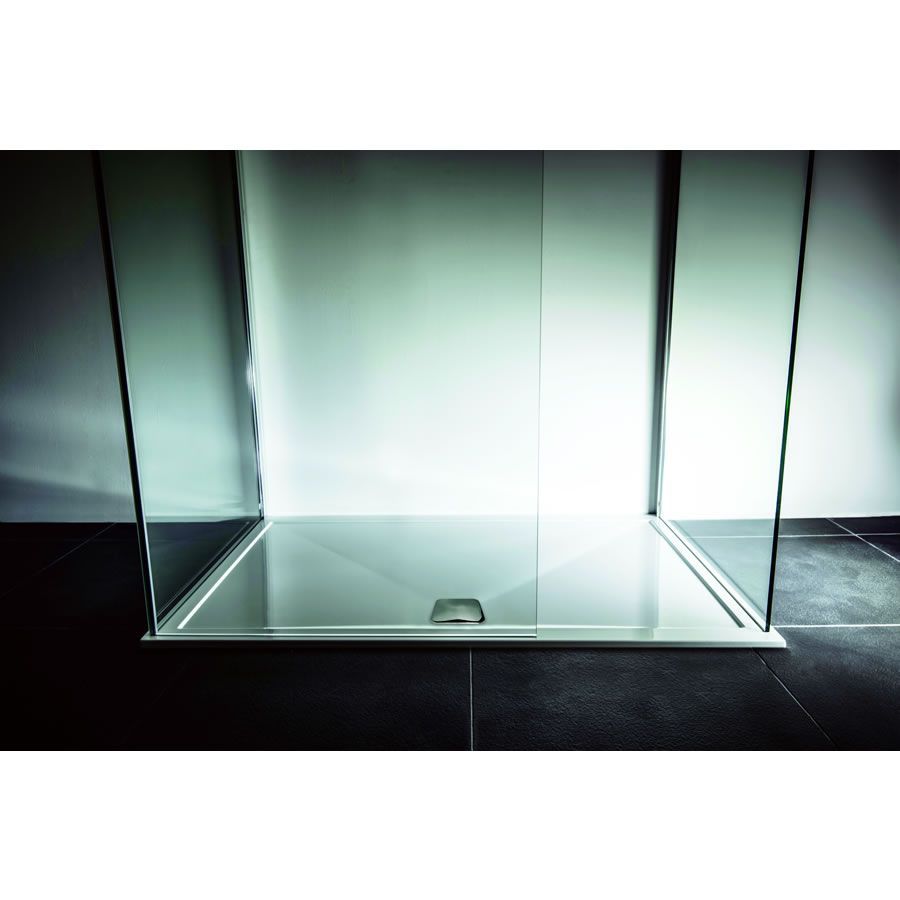 Installed TrayMate TM25 Elementary OFFSET QUADRANT shower tray, 1100 x 800mm, with glass enclosure. Showcases a stylish, low-profile design for contemporary bathrooms.