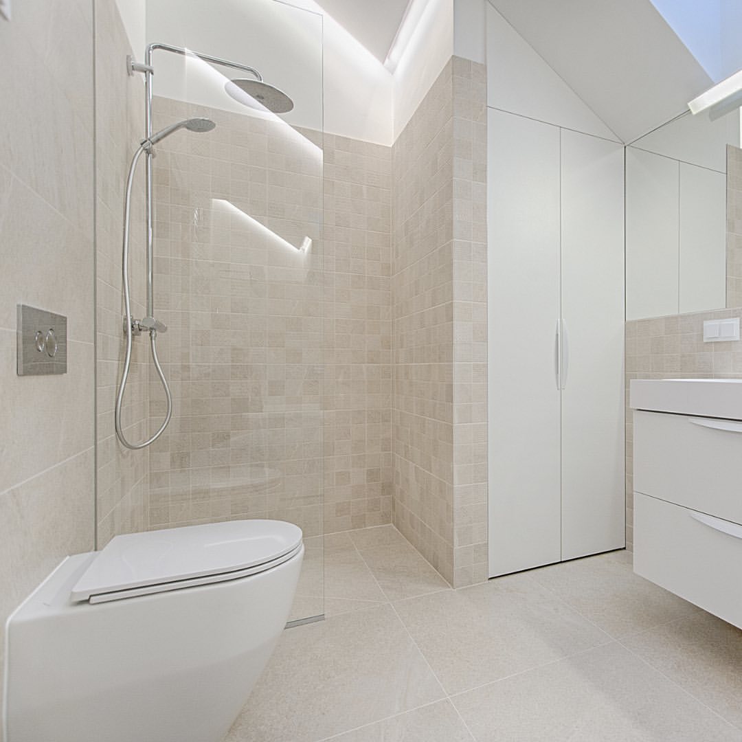 Modern wetroom with sleek shower and minimalist design.