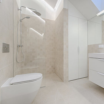 Modern wetroom with sleek shower and minimalist design.