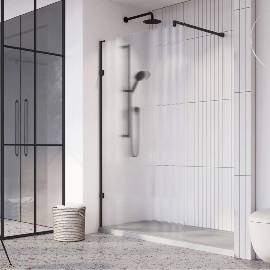 Modern wet room with sleek glass partition and minimalist design.