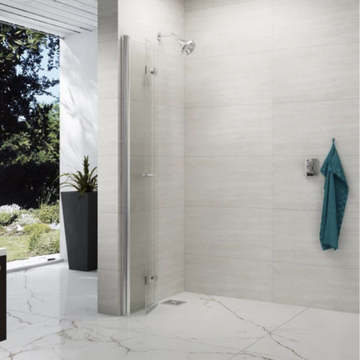 Modern bathroom with glass shower screen and marble flooring.