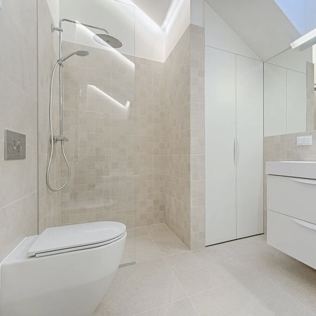 Modern minimalist bathroom with sleek fixtures and neutral tones.