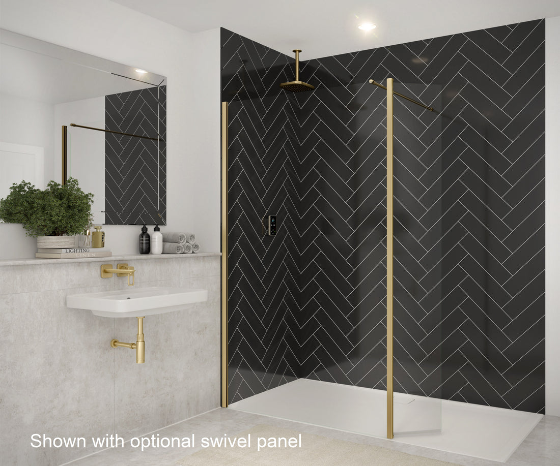 Merlyn 8mm wetroom panel shower screen with optional swivel panel. Brushed brass frame complements black herringbone tiles.