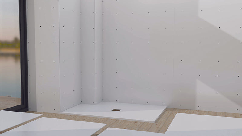Aqua4ma Evolution Wetroom Deck Tray installed in a modern wetroom with waterproof wall panels, featuring a center waste for efficient drainage.