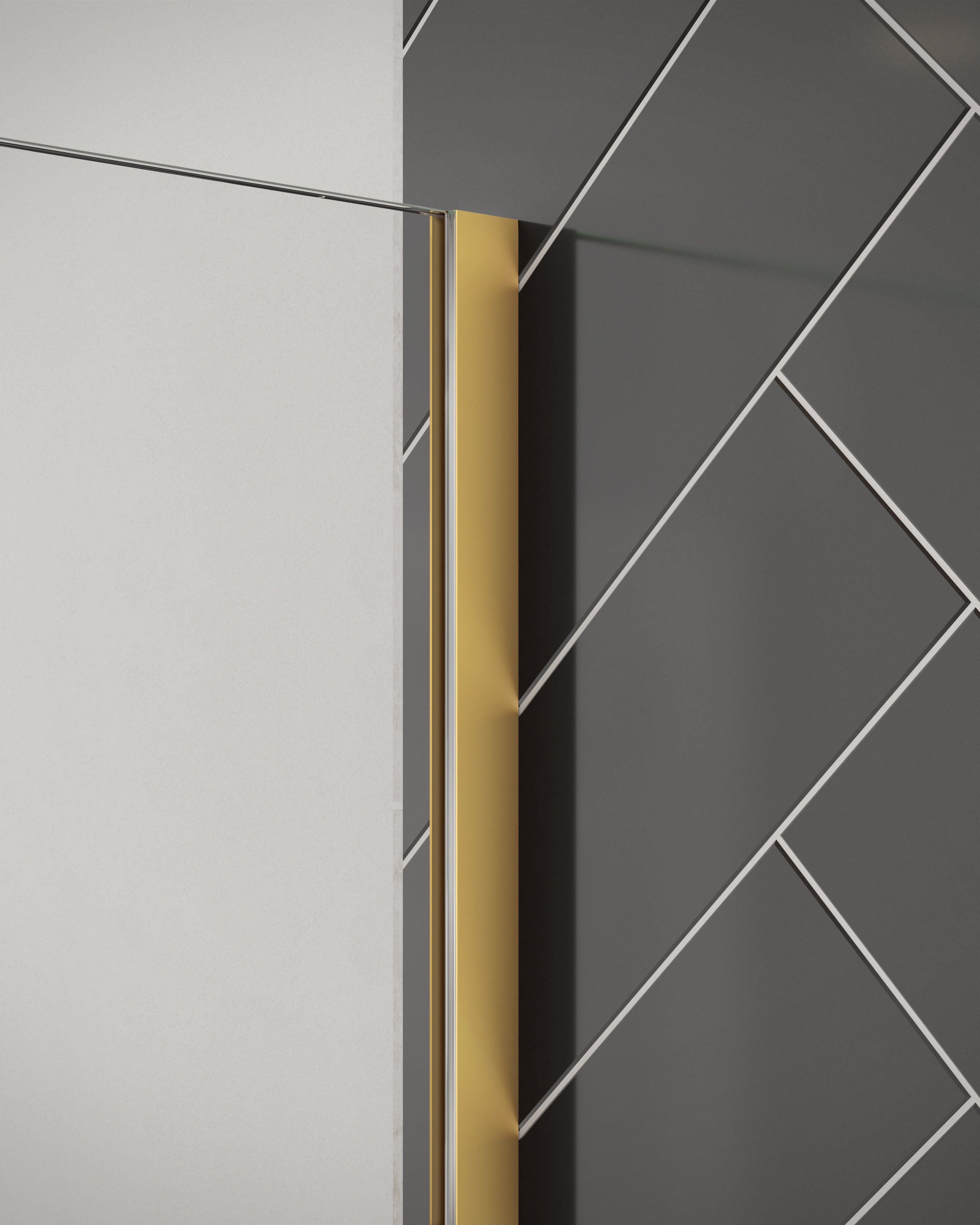 Close-up of Merlyn 8mm wetroom panel shower screen with brushed brass wall profile. Installed against black herringbone tiles.
