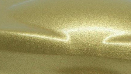 Close-up of the Octad Gold Gloss finish, showcasing its smooth, reflective surface. Ideal for enhancing the elegance of wet room drain covers.
