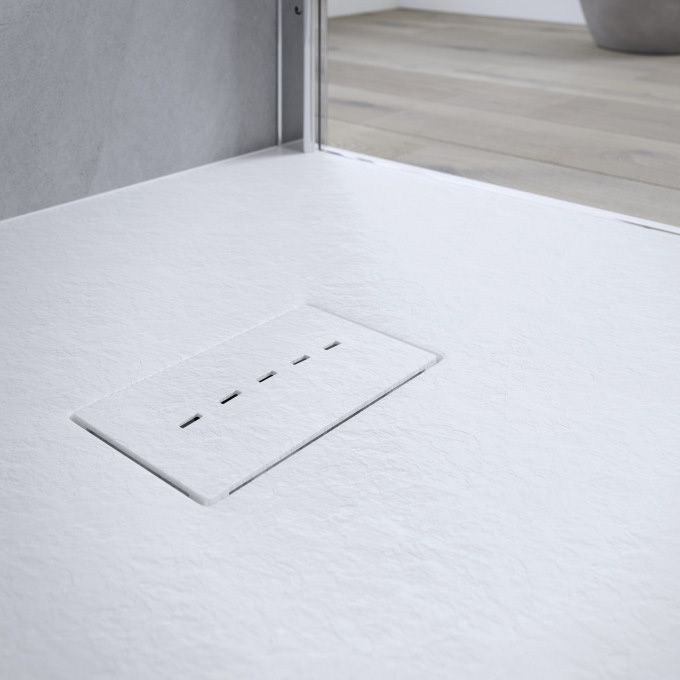 Close-up of AKW Onyx white slate effect shower tray surface