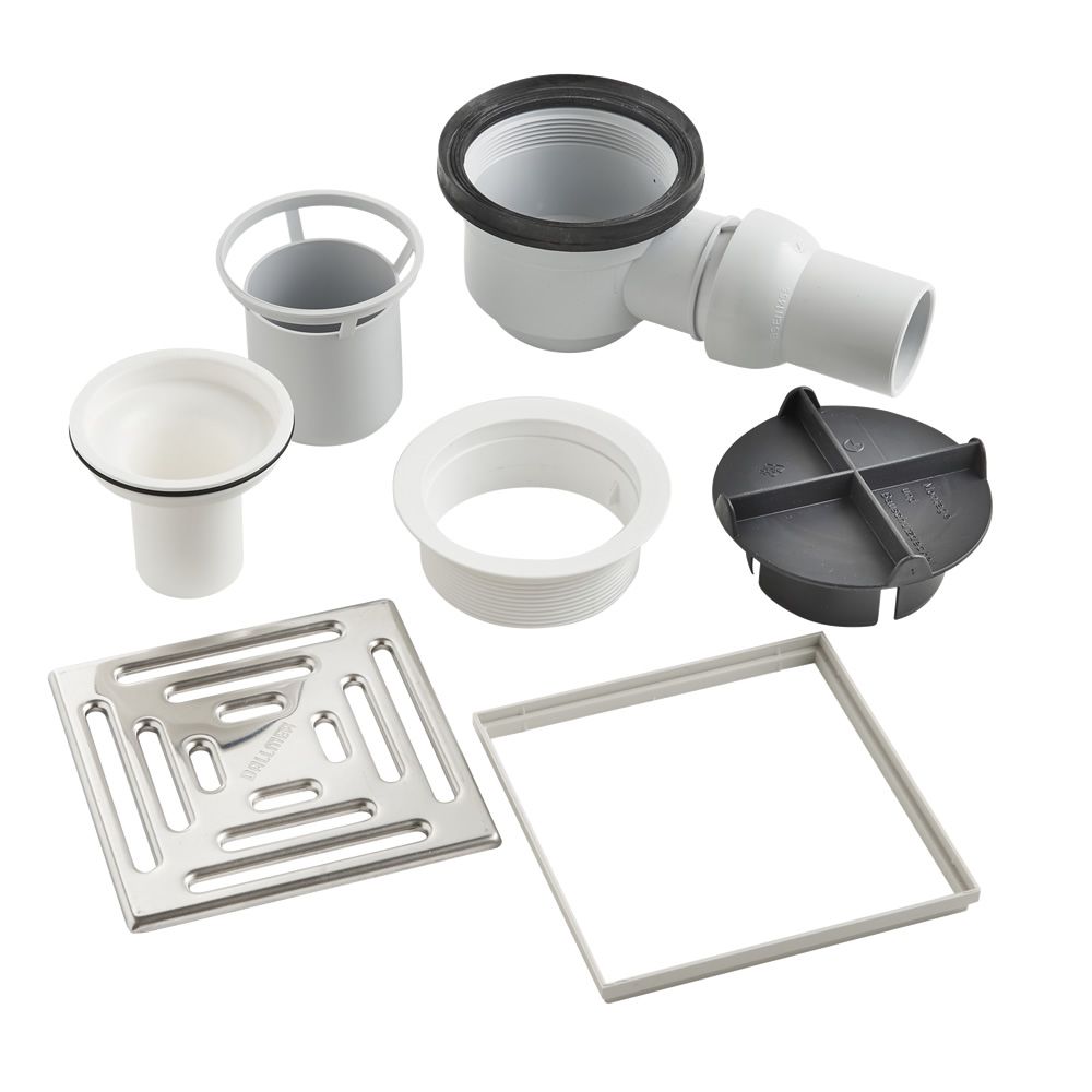 WetBase® shower tray drain kit with stainless steel cover, waste trap, and sealing components for efficient drainage in wet rooms.