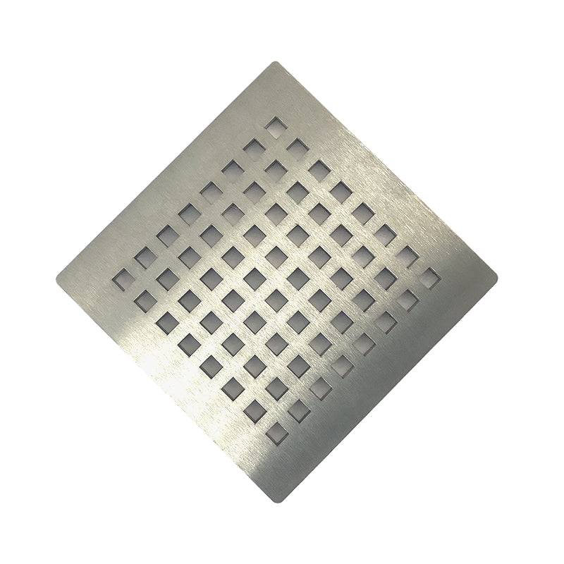 Brushed stainless steel drain cover with square holes.