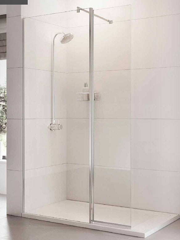 Roman Haven Pivoting Shower Screen Deflector Panel installed in a modern wet room. Features a sleek frameless design with a chrome support bar.